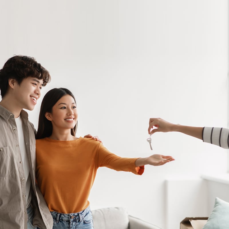 A pair of couple is hugging and smiling